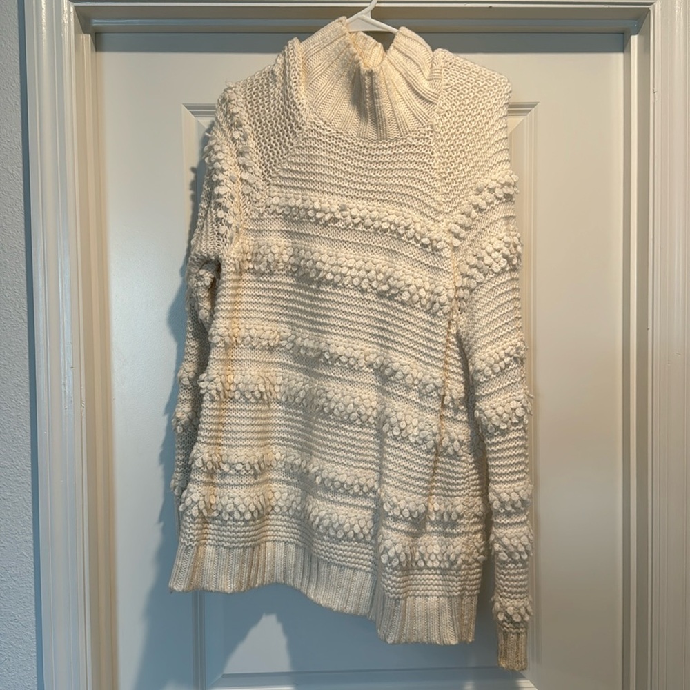 Cream textured sweater.